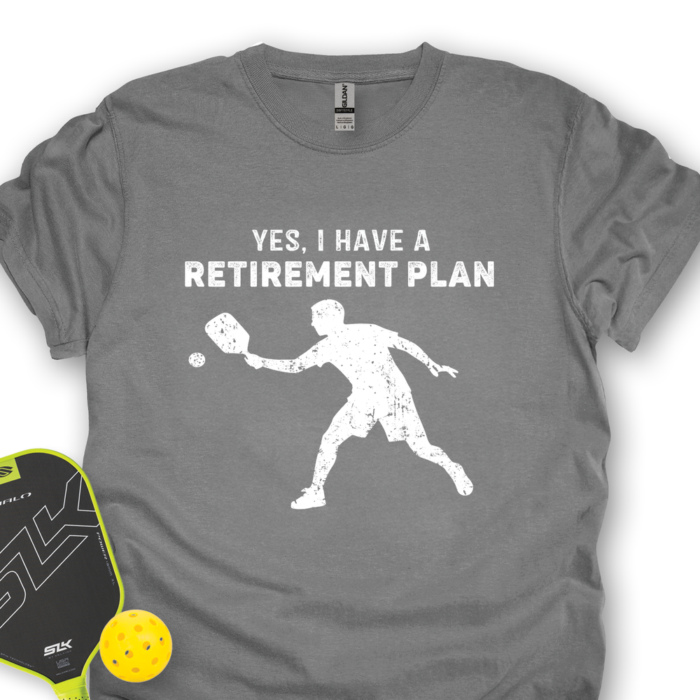 Gray t-shirt with a white graphic and text 'YES, I HAVE A RETIREMENT PLAN' on a white background.