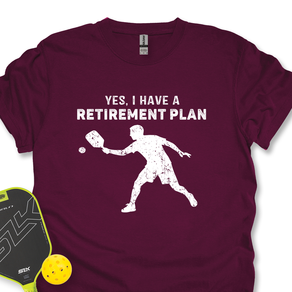 Maroon t-shirt with white graphic and text 'YES, I HAVE A RETIREMENT PLAN' on a white background.