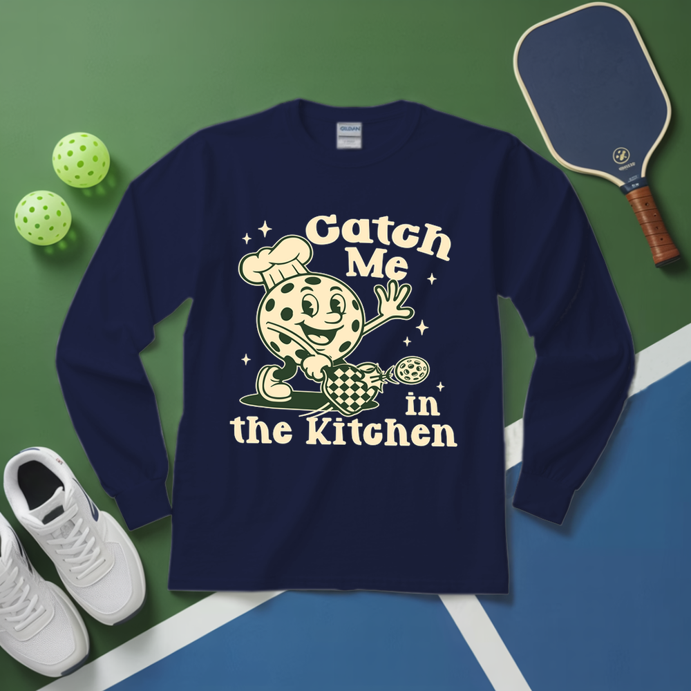 Navy blue long-sleeve shirt with a graphic design and text on a green and blue background with sports equipment.