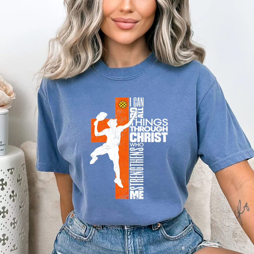 Person wearing a blue t-shirt with a graphic design and text.
