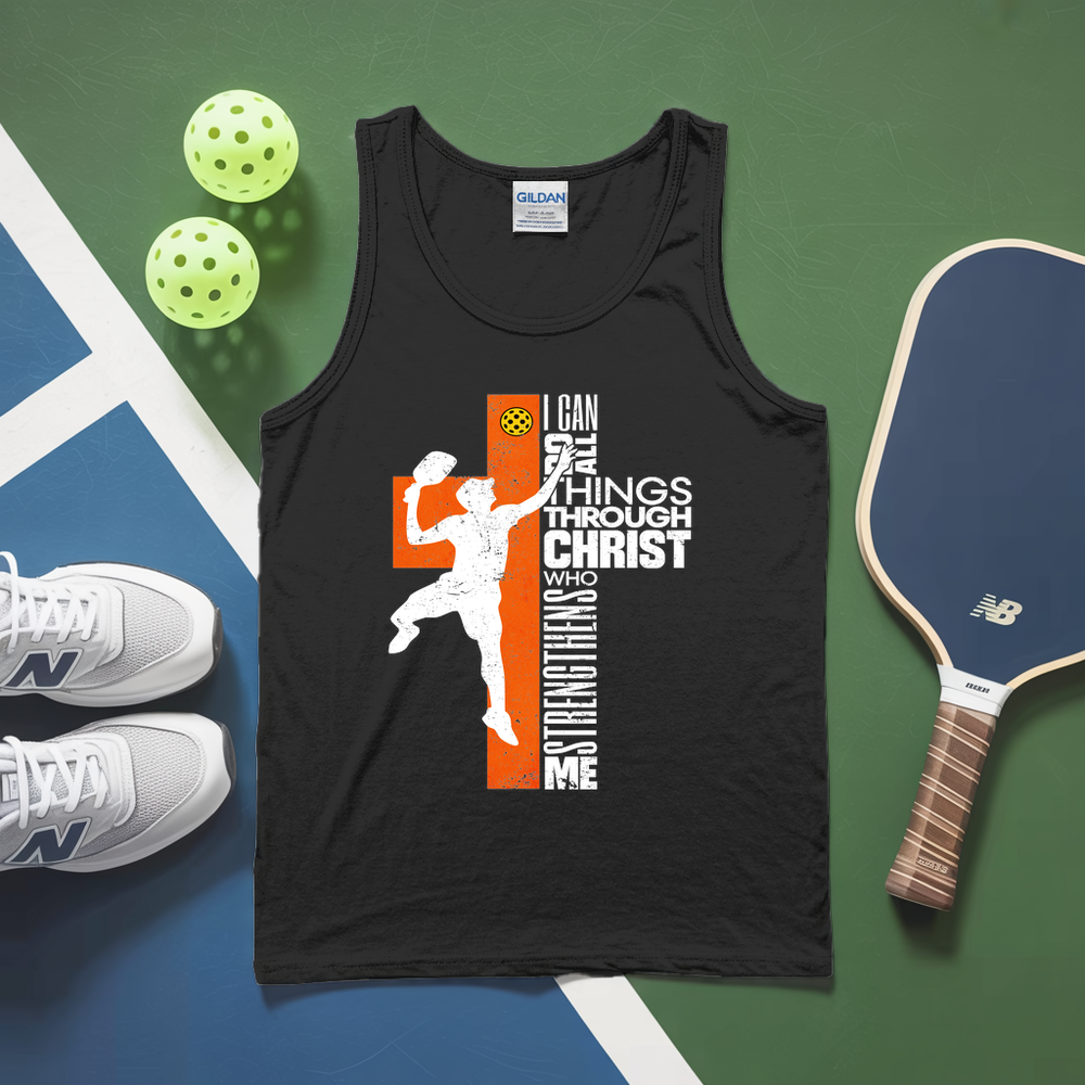 Black tank top with motivational graphic on a sports-themed background with pickleball equipment.