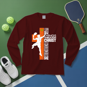 Maroon long-sleeve shirt with sports-themed design on a green and blue background with sports equipment.