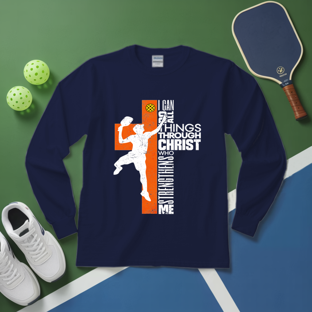 Navy long-sleeve shirt with pickleball design on a green and blue surface with pickleballs and a paddle.