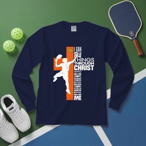 Navy long-sleeve shirt with pickleball design on a green and blue surface with pickleballs and a paddle.