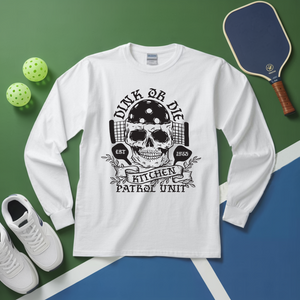 White long-sleeve shirt with skull graphic and text on a green and blue background with sports equipment.
