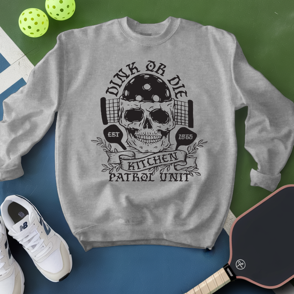 Gray sweatshirt with skull design and text on a green and blue background