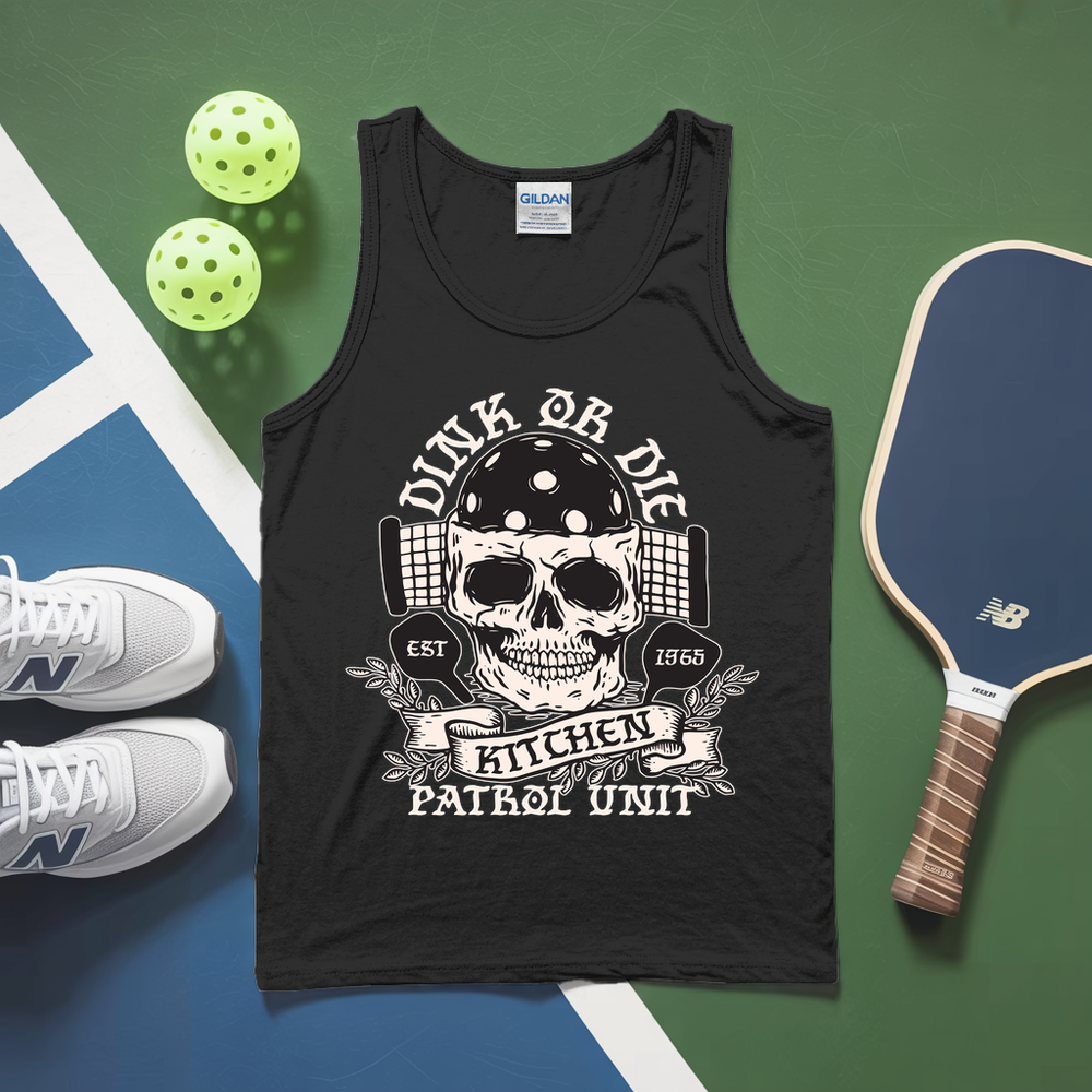 Black tank top with skull design and text, placed on a sports-themed surface with pickleball equipment.
