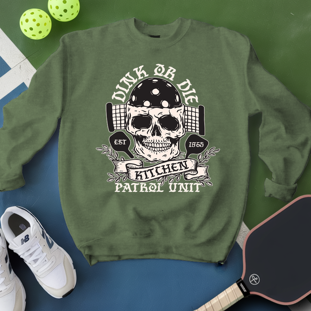 Green sweatshirt with skull graphic and text on a blue and green background
