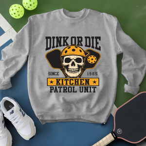 Gray sweatshirt with skull graphic and text on a green and blue background
