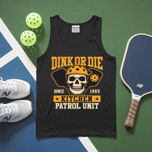 Black tank top with skull graphic and text on a green and blue surface with pickleball equipment.
