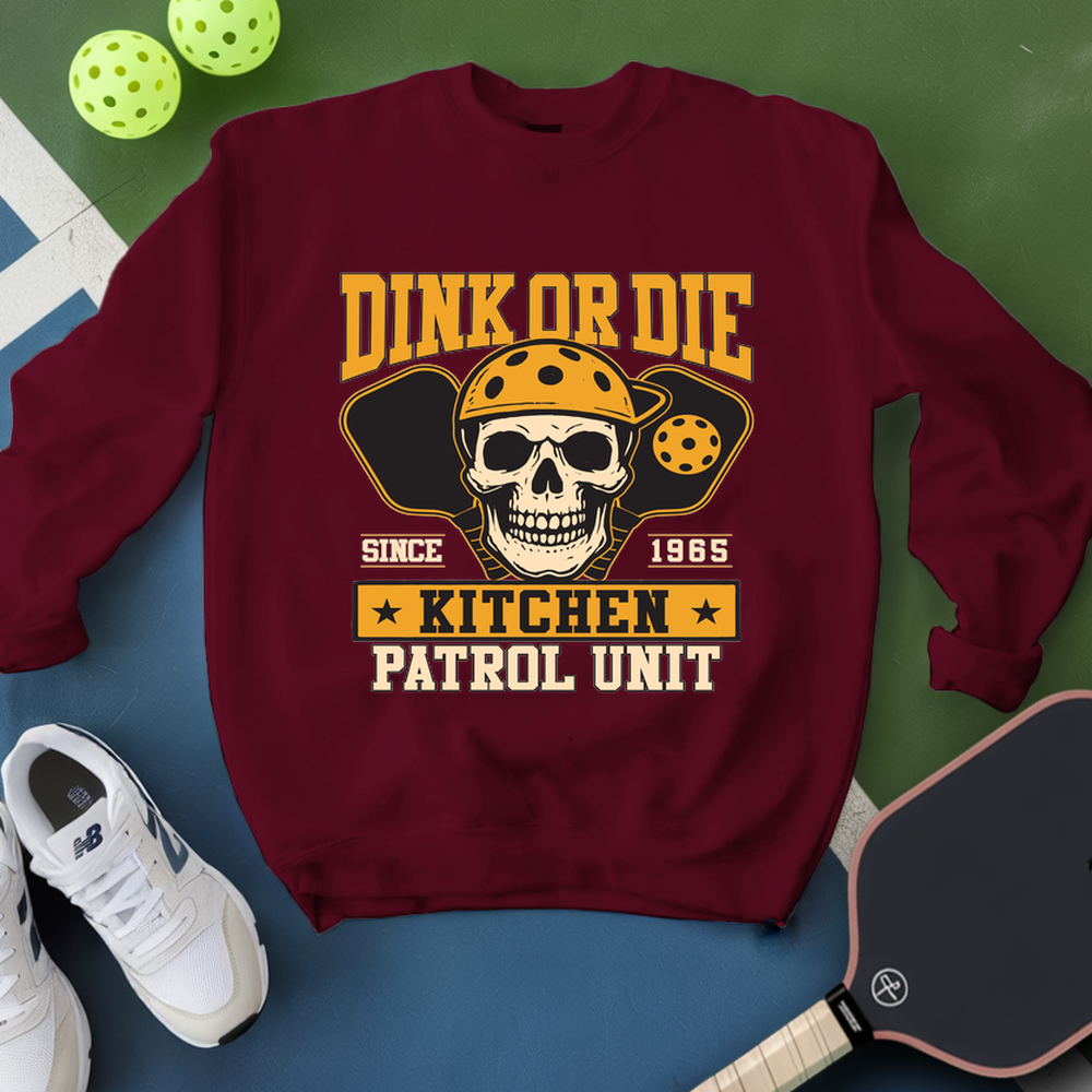 Maroon sweatshirt with skull graphic and text on a green and blue background