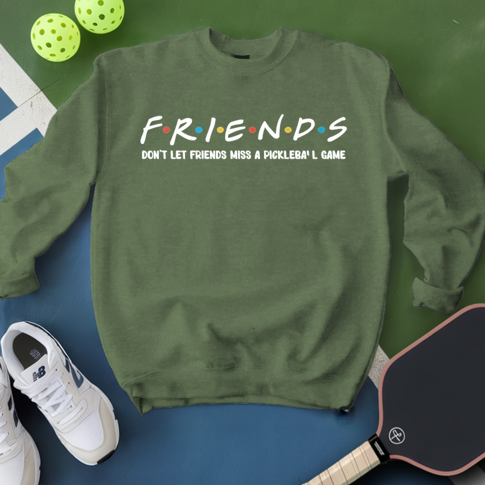 Green sweatshirt with 'FRIENDS' text, pickleball balls, paddle, and shoes on a green and blue background