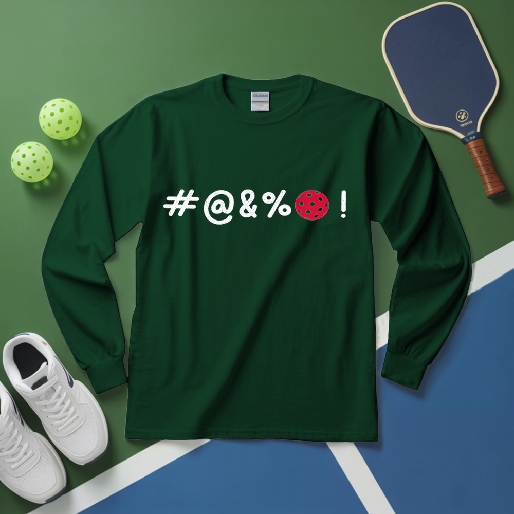Green long-sleeve shirt with offensive language and pickleball elements on a green and blue surface.
