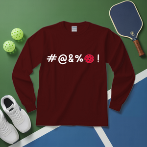 Maroon long-sleeve shirt with '#@&%' text and pickleball elements on a green and blue surface.