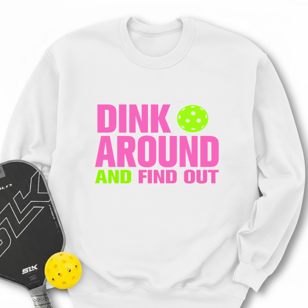 White sweatshirt with 'Dink Around and Find Out' text, pickleball paddle, and ball on a white background