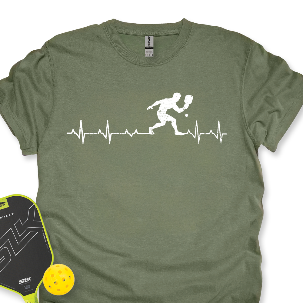 Green t-shirt with pickleball design and paddle and ball on a white background