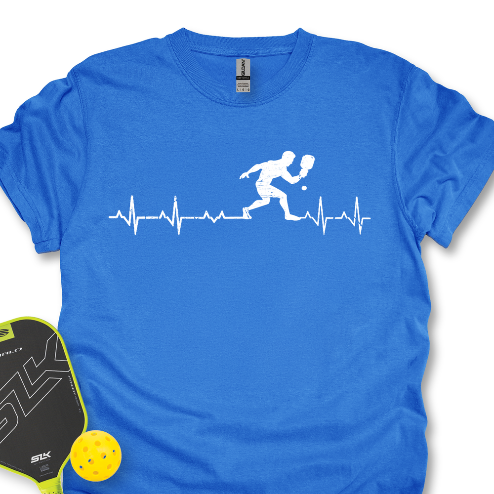 Blue t-shirt with pickleball design and paddle and ball on a white background