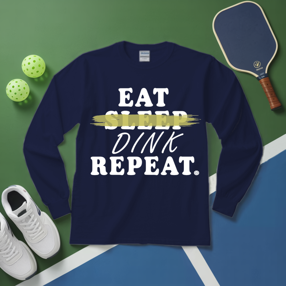 Navy blue sweatshirt with 'Eat Sleep Dink Repeat' text on a green and blue background with pickleball equipment.