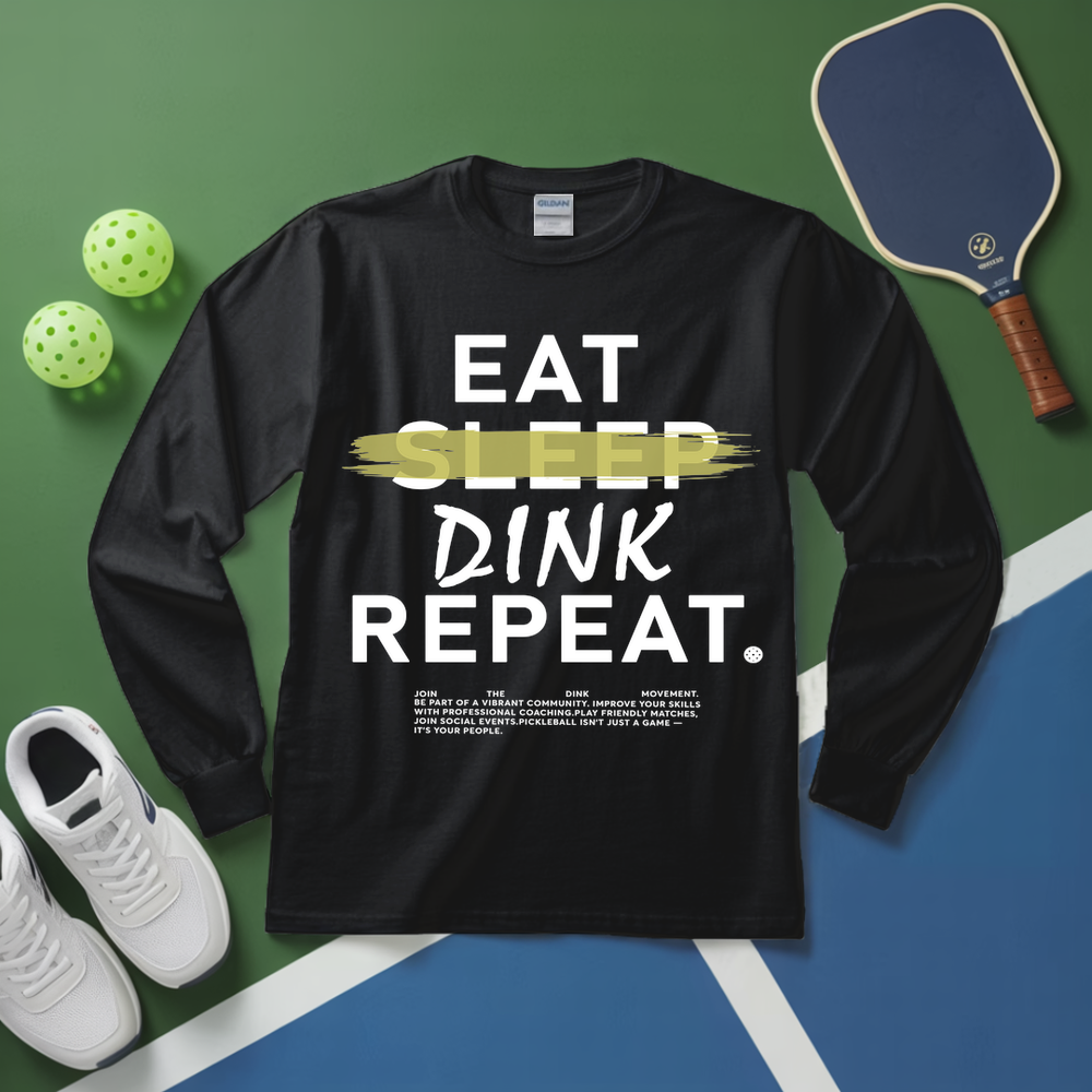 Black long-sleeve shirt with 'Eat Sleep Dink Repeat' text on a pickleball court background.