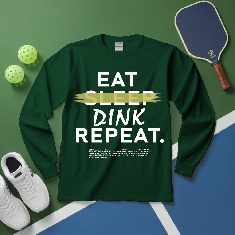 Green long-sleeve shirt with 'Eat Sleep Dink Repeat' text on a pickleball court background.