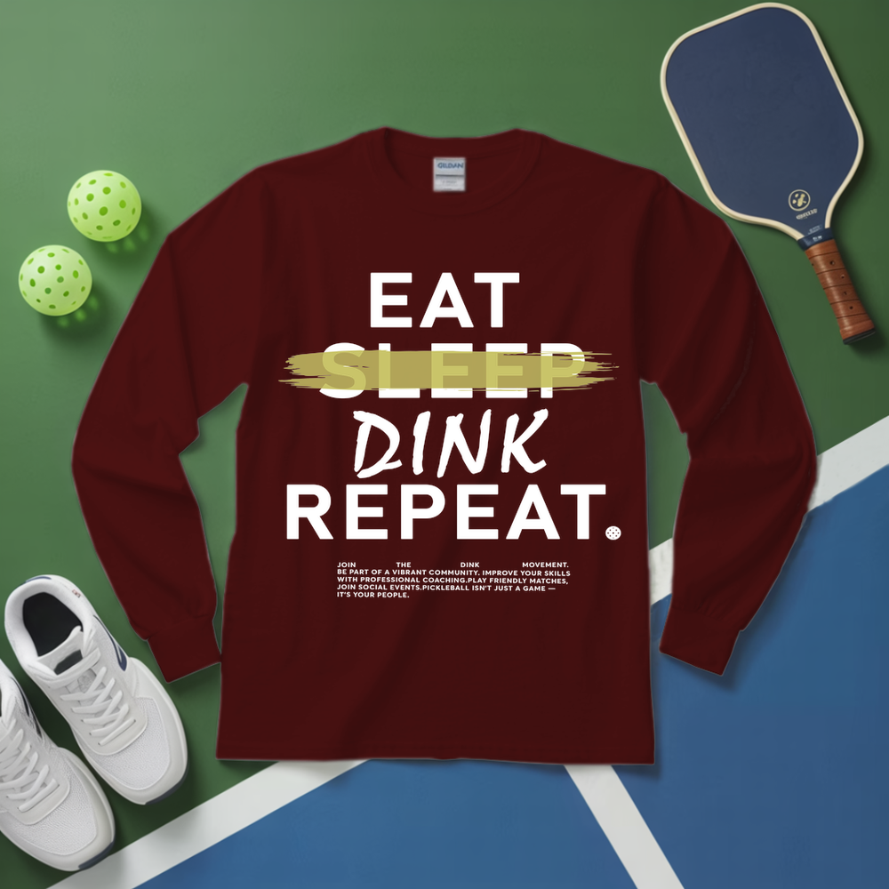 Maroon long-sleeve shirt with 'Eat Sleep Dink Repeat' text on a pickleball-themed background.