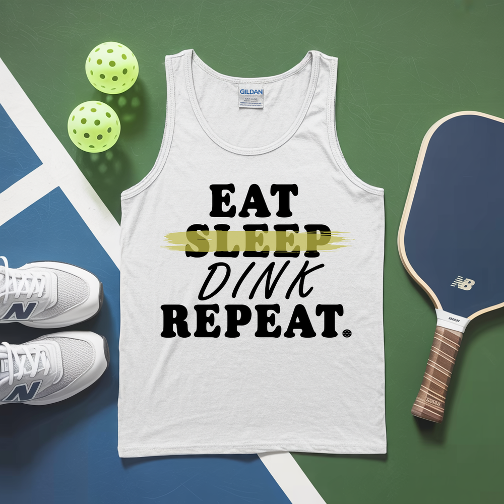 White tank top with 'EAT SLEEP DINK REPEAT' text, pickleball paddles, and balls on a green and blue surface.