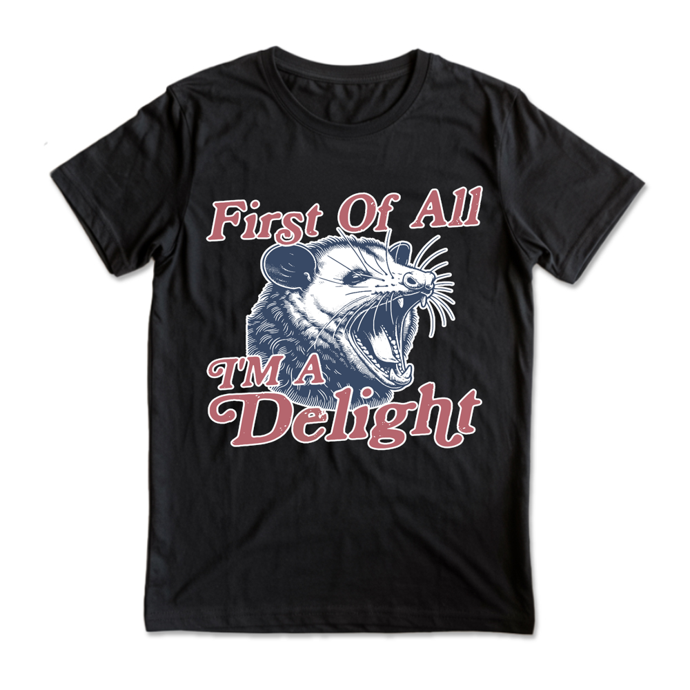 Black t-shirt with a graphic of a opossum and text 'First Of All I'm A Delight' on a white background