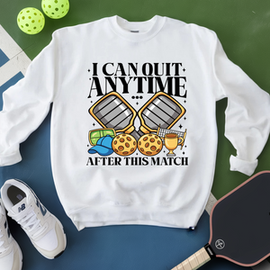 White sweatshirt with pickleball-themed design on a green and blue background