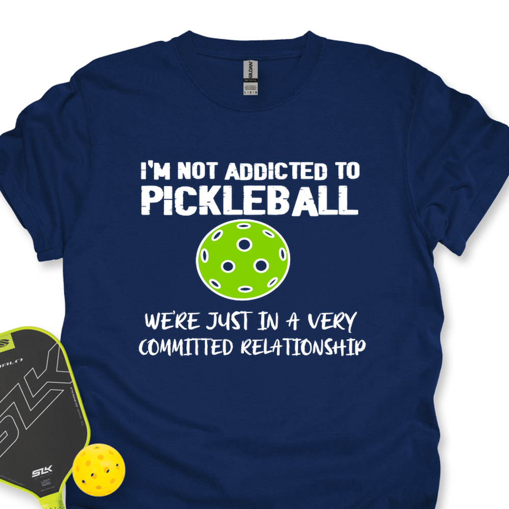 Navy blue t-shirt with pickleball-themed text and graphics on a white background