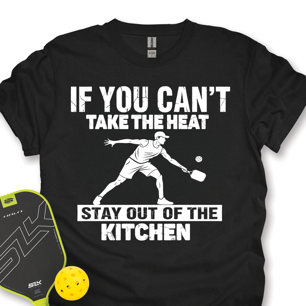Black t-shirt with graphic and text 'If you can't take the heat, stay out of the kitchen' on a white background.