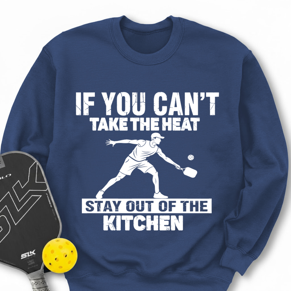 Blue sweatshirt with pickleball graphic and text, next to a pickleball paddle and ball.