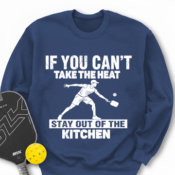 Blue sweatshirt with pickleball graphic and text, next to a pickleball paddle and ball.