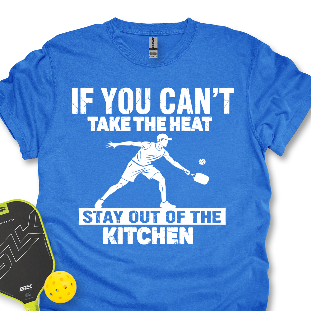 Blue t-shirt with white text and graphic of a paddle player, accompanied by a paddle and ball on a white background.