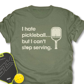 Green t-shirt with pickleball-themed text and graphics on a white background