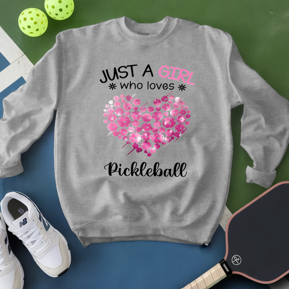 Gray sweatshirt with pink heart and text about pickleball on a green and blue background.