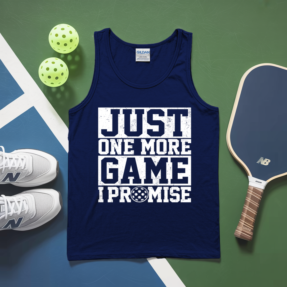 Navy tank top with 'Just One More Game I Promise' text on a sports-themed background with pickleball equipment.
