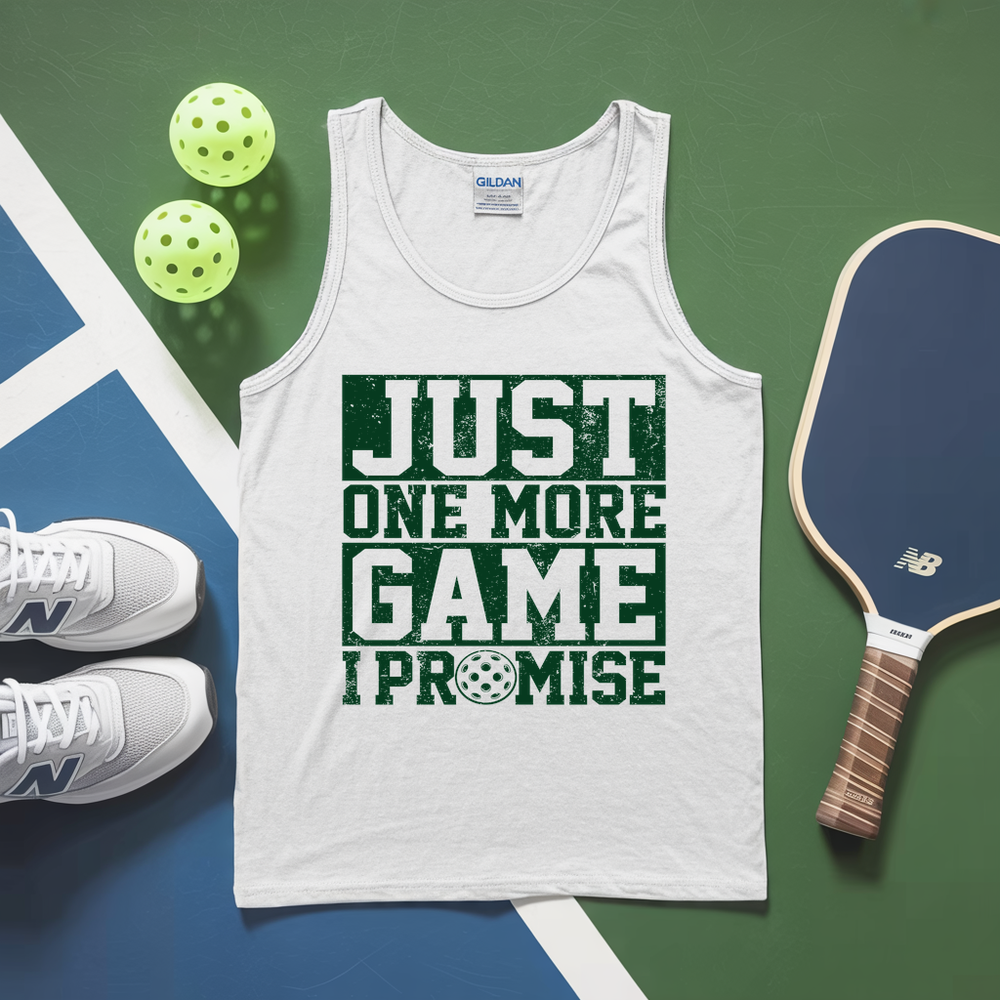 White tank top with 'Just One More Game I Promise' text, pickleball paddles, and balls on a green and blue background.