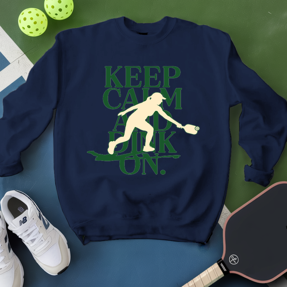 Navy sweatshirt with pickleball-themed design on a green and blue background