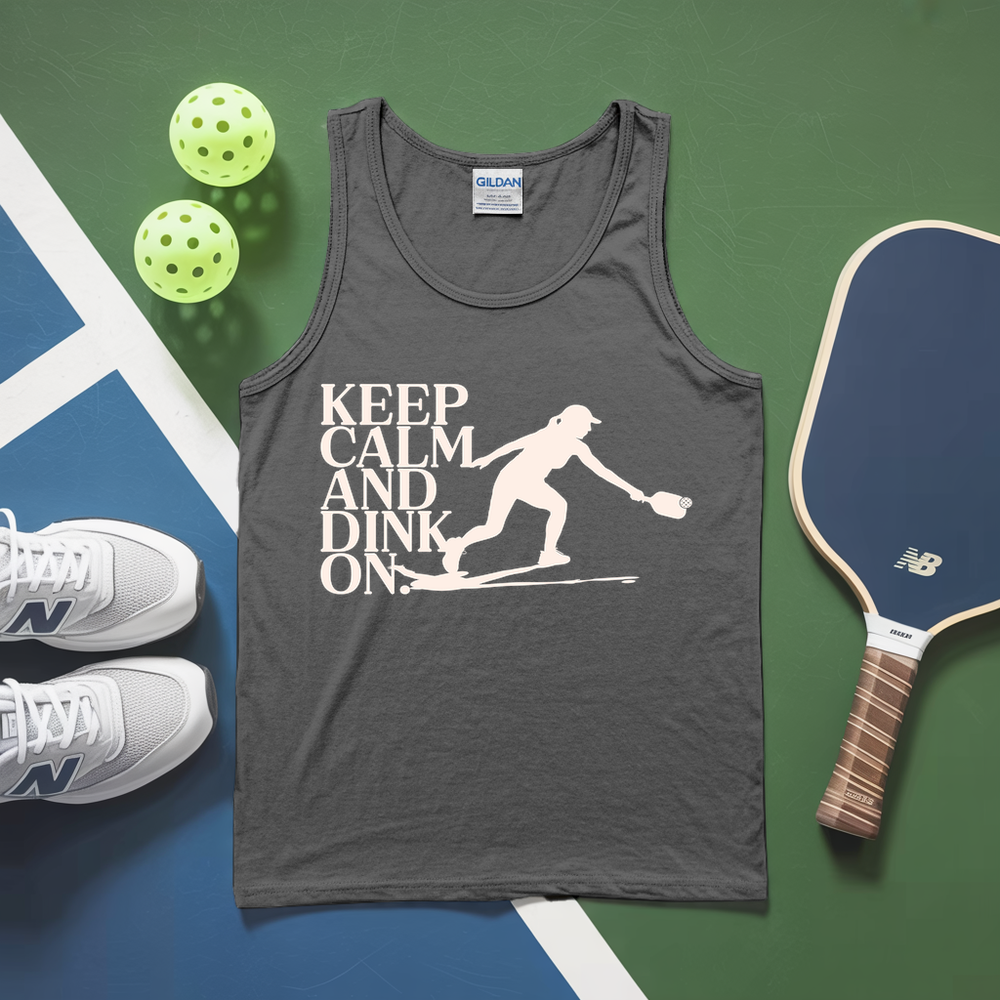 Gray tank top with 'Keep Calm and Dink On' graphic, pickleball paddles, and balls on a green and blue surface.