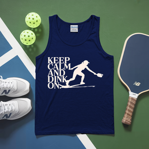 Navy tank top with 'Keep Calm and Dink On' text and pickleball equipment on a green and blue surface.
