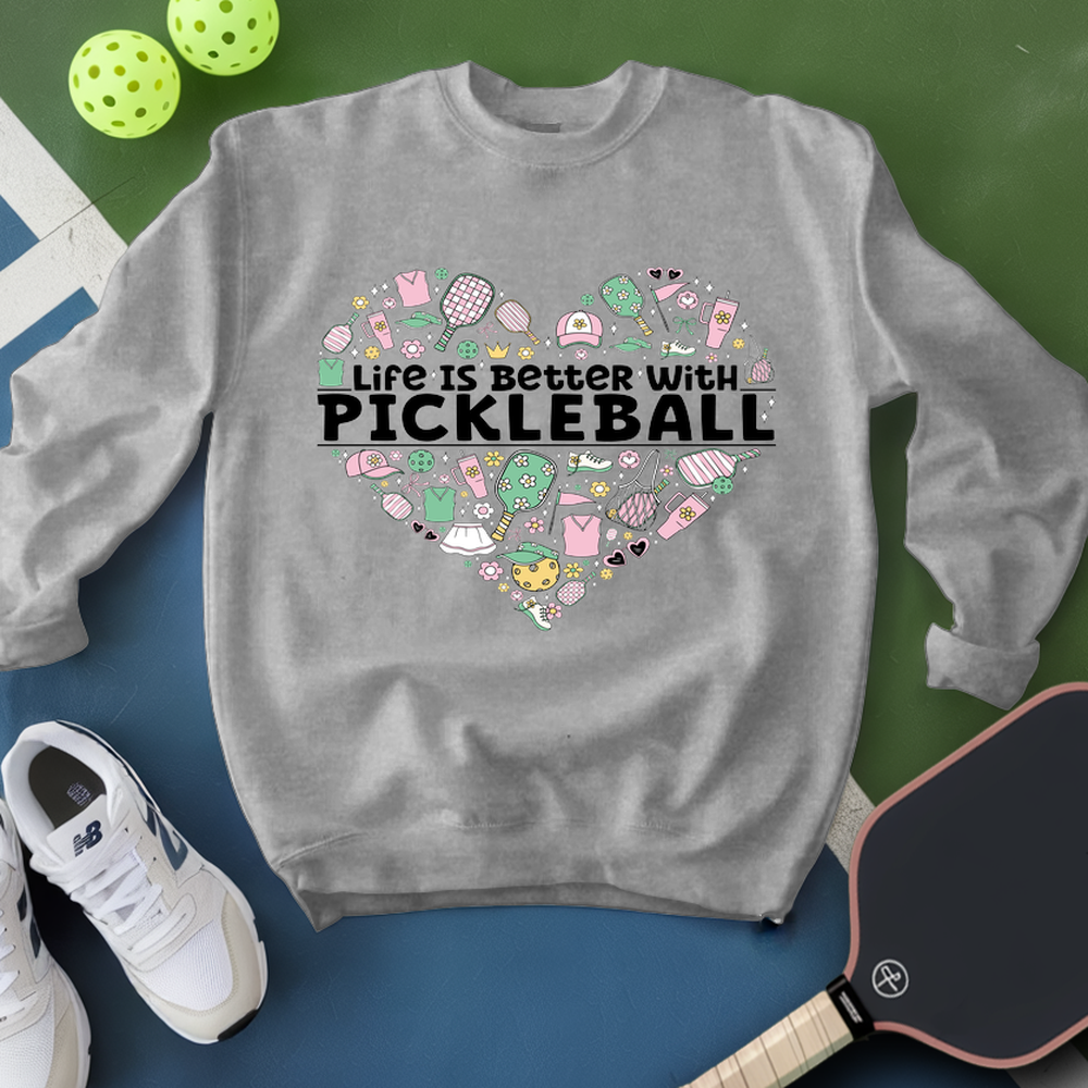 Gray sweatshirt with 'Life is better with pickleball' design on a green and blue background with pickleballs and a paddle.