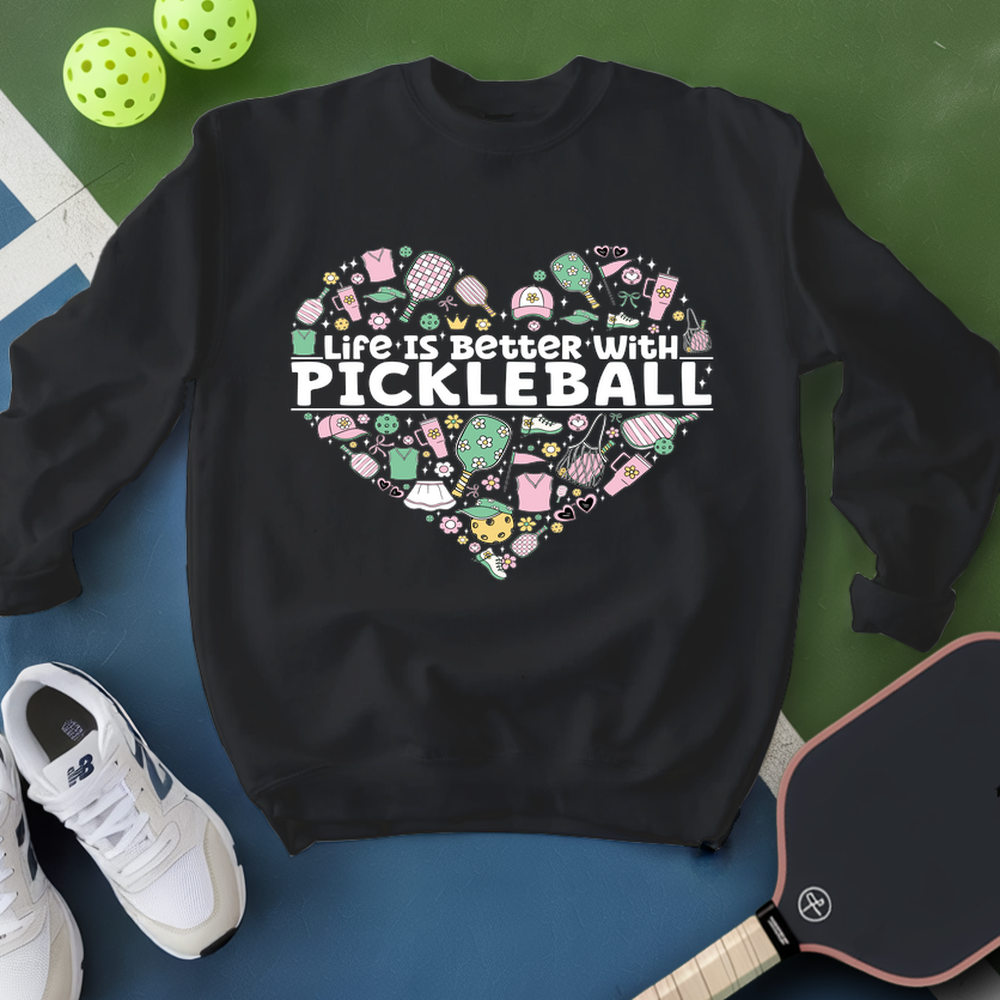 Black sweatshirt with pickleball-themed design on a blue and green background