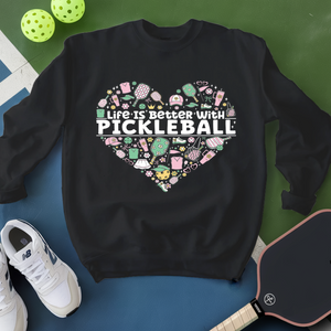 Black sweatshirt with pickleball-themed design on a blue and green background