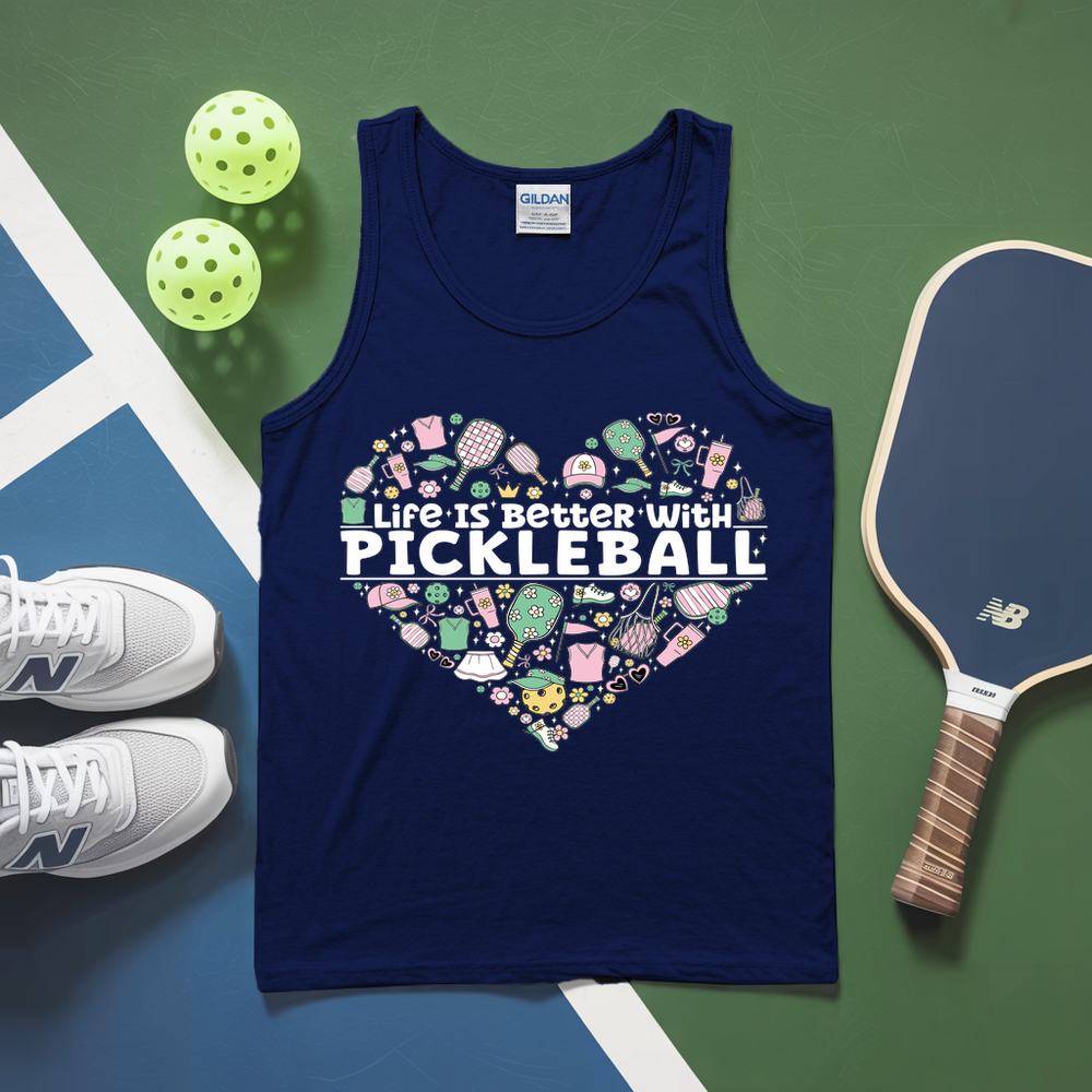 Navy tank top with pickleball design and text on a green and blue surface with pickleballs and a paddle.