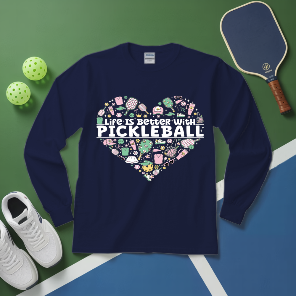 Navy blue sweatshirt with pickleball-themed design on a green and blue surface with pickleballs and a paddle.