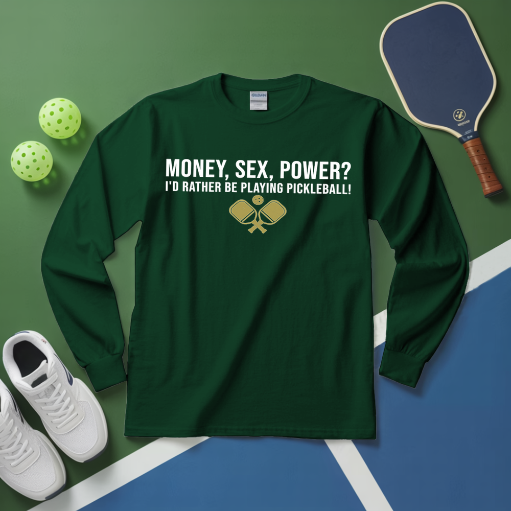 Green long-sleeve shirt with pickleball-themed text on a green and blue surface with pickleball equipment.