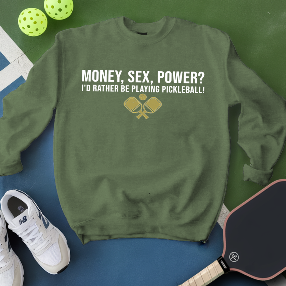 Green sweatshirt with pickleball-themed text and graphics on a blue and green background with pickleballs and a paddle.