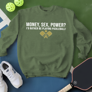 Green sweatshirt with pickleball-themed text and graphics on a blue and green background with pickleballs and a paddle.
