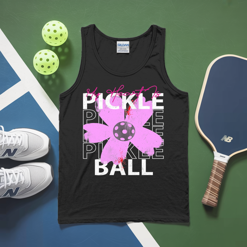 Black tank top with pickleball design on a green and blue background with pickleballs and a paddle.