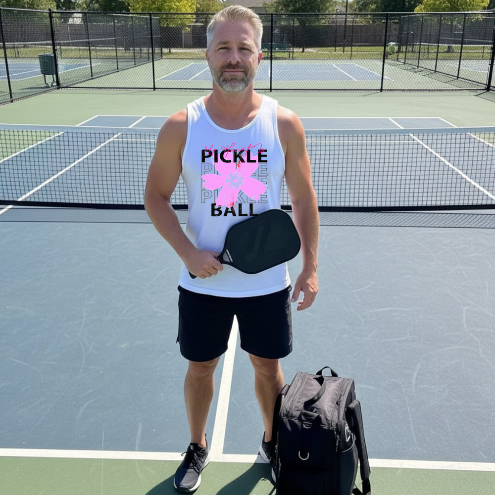 Gray tank top with pickleball design on a green and blue surface with pickleballs and a paddle.